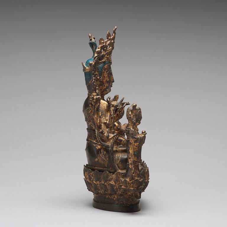 A bronze sculpture of boddhisattva and two attendants, Ming dynasty (1368-1644).