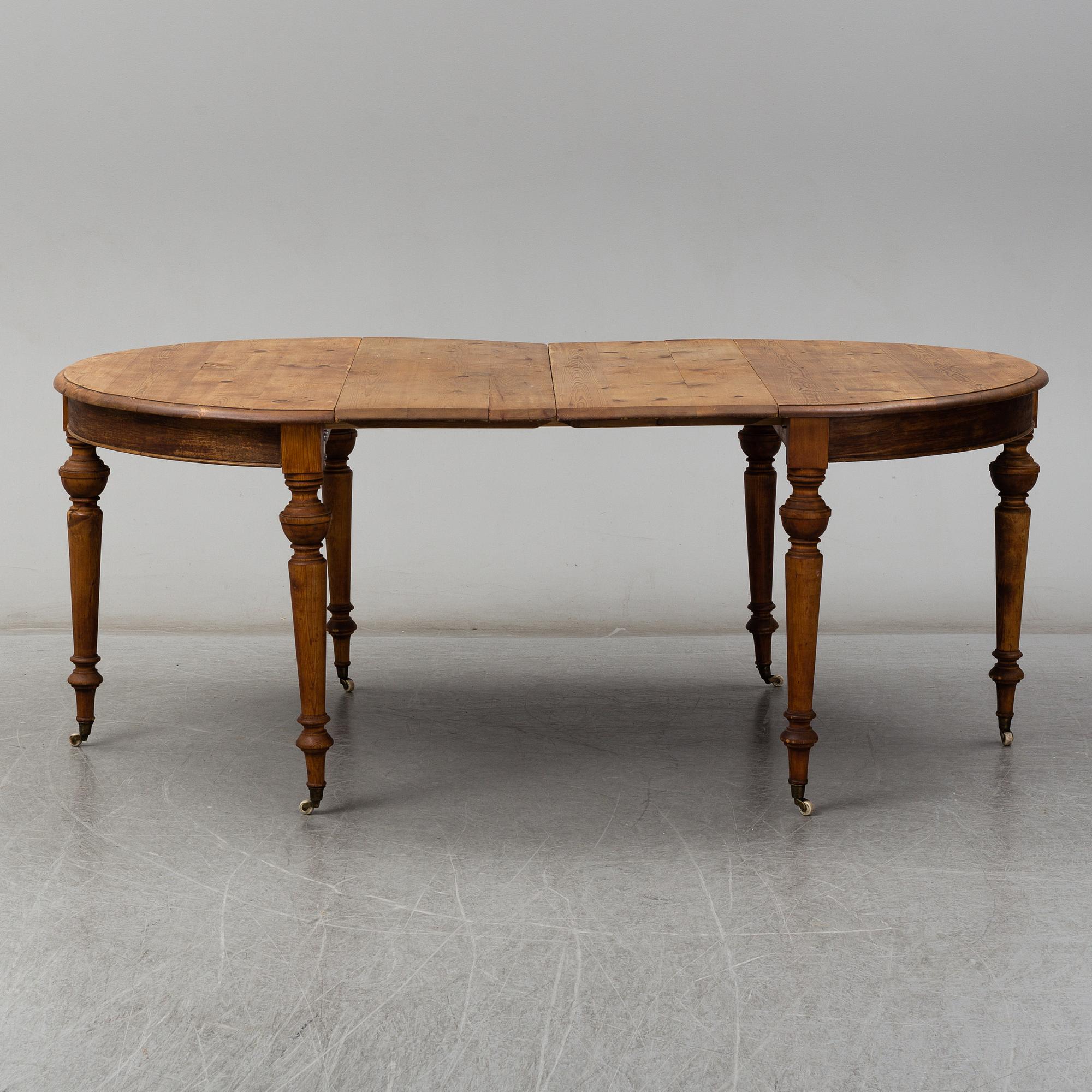 A ca 1900 dining table in two parts, two leaves included. - Bukowskis