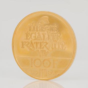 GULDMYNT. 100 Francs, 1986. Vikt ca 17 g.