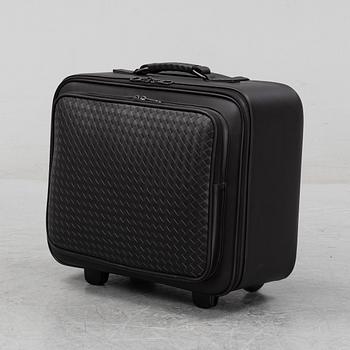 Bottega Veneta, an intrecciato leather suitcase.