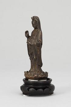 A Chinese 18th century bronze figure of Guanyin.