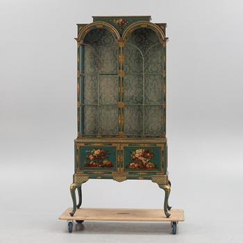 A display cabinet, England, early 20th Century.