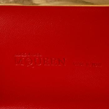 ALEXANDER MCQUEEN, a red nubuc leather "Knucklebox Clutch".