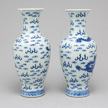 A pair of Chinese blue and white dragon vases, early 20th century, with a Qianlong mark.