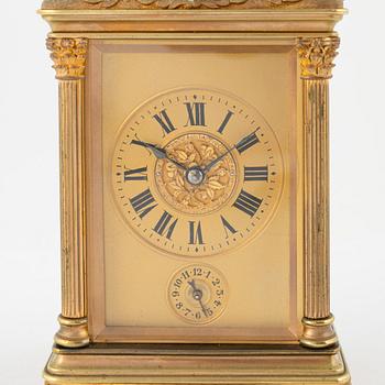 A French Brass and Glass Aiguilles Carriage Clock with Leather Case, first half of the 20th century.