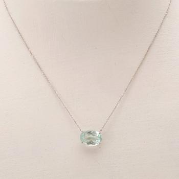 An 18K white gold necklace with an oval faceted aquamarine.