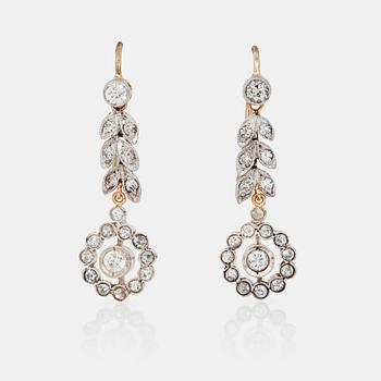 658. A pair of flower shaped old-cut diamond earrings.