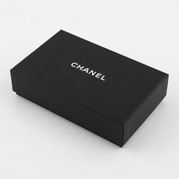 Chanel, a purple quilted leather wallet, 2014-15.