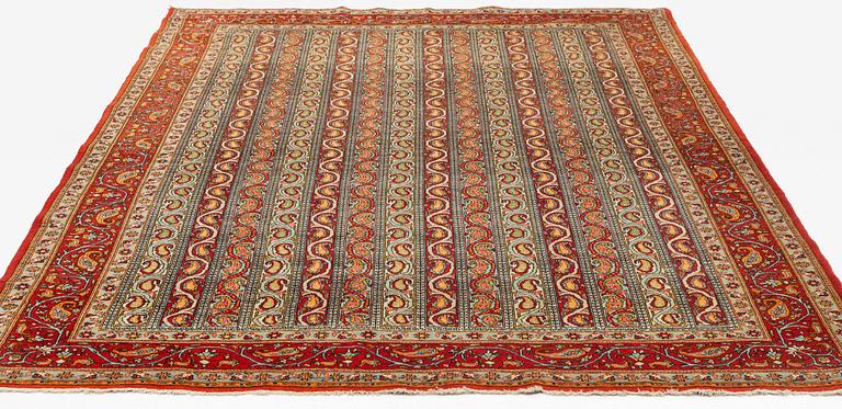 A carpet, semi-antique, Qum, ca 318 x 233 cm.