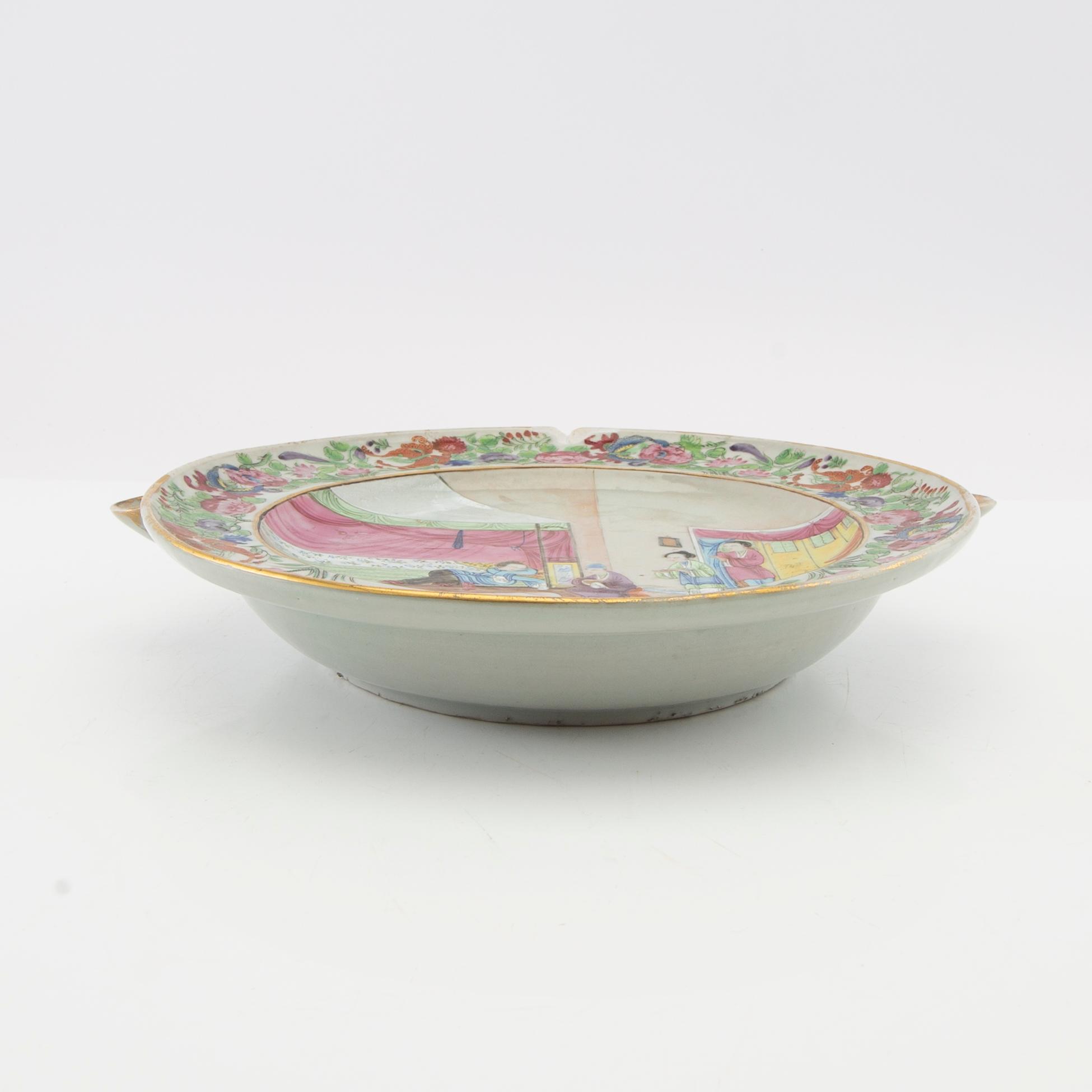 A Chinese Canton famille rose hot water dish, Qing dynasty, 19th century.