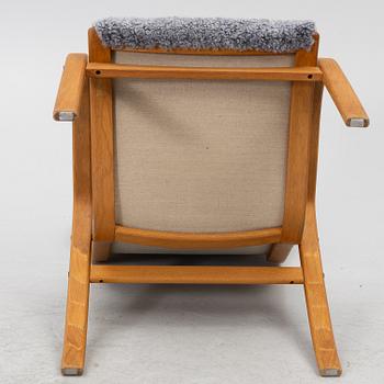 Jan Ekström, armchair with footstool "Gazelle", Conform, 21st century.