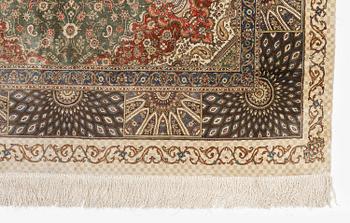 A silk Qum, Central Persia. signed Mohammad Gamshidi, c. 203 x 126 cm.