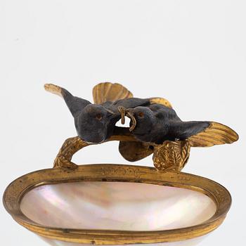 A gilt-bronze and mother of pearl stand for a pocket watch, later part 19th century.