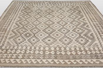 A Kilim rug, approx. 294 x 250 cm.