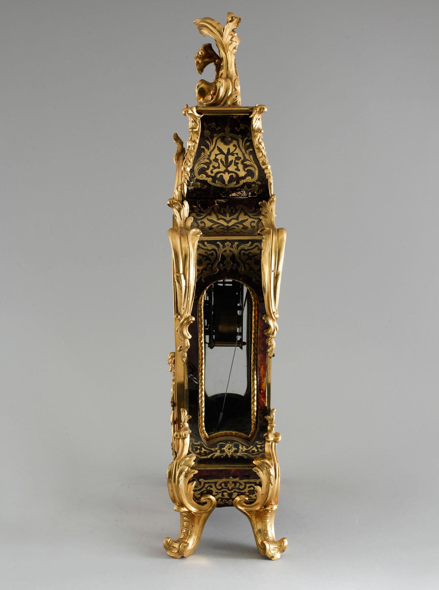 A 19th century mantle clock in the style of Louis XV.