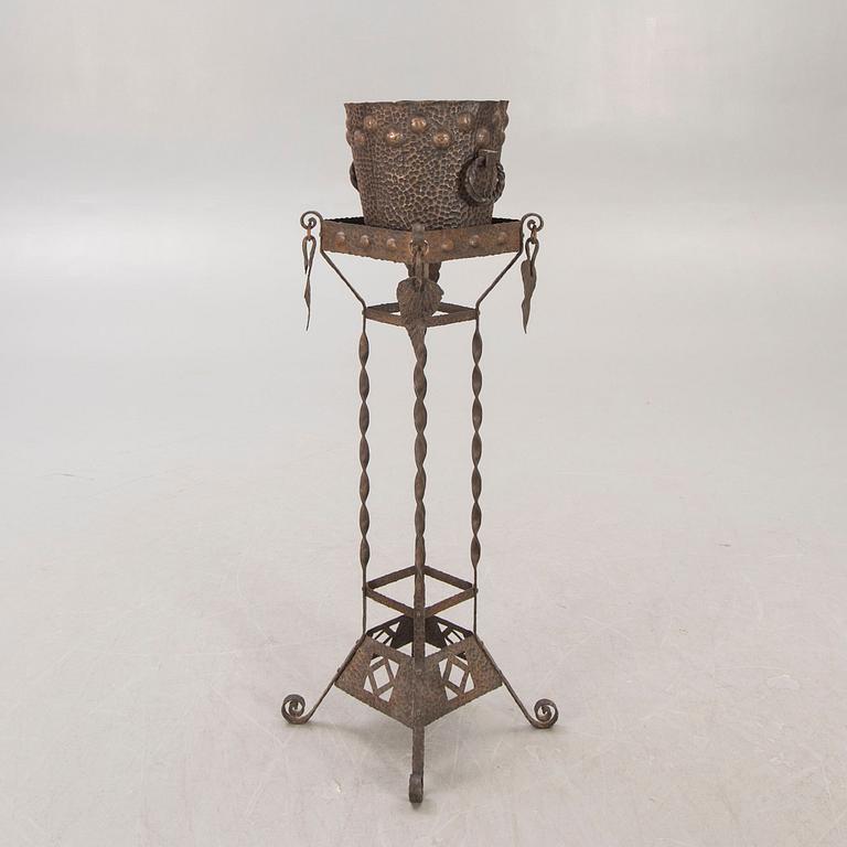 A metal pedestal and urn early 1900s.