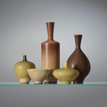 A Berndt Friberg set of 24 miniature stoneware vases and bowls in a teak casket, Gustavsberg Studio.