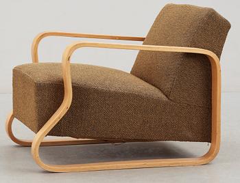 An Alvar Aalto laminated birch 'padded Paimio chair', upholstered in yellow and black fabric.