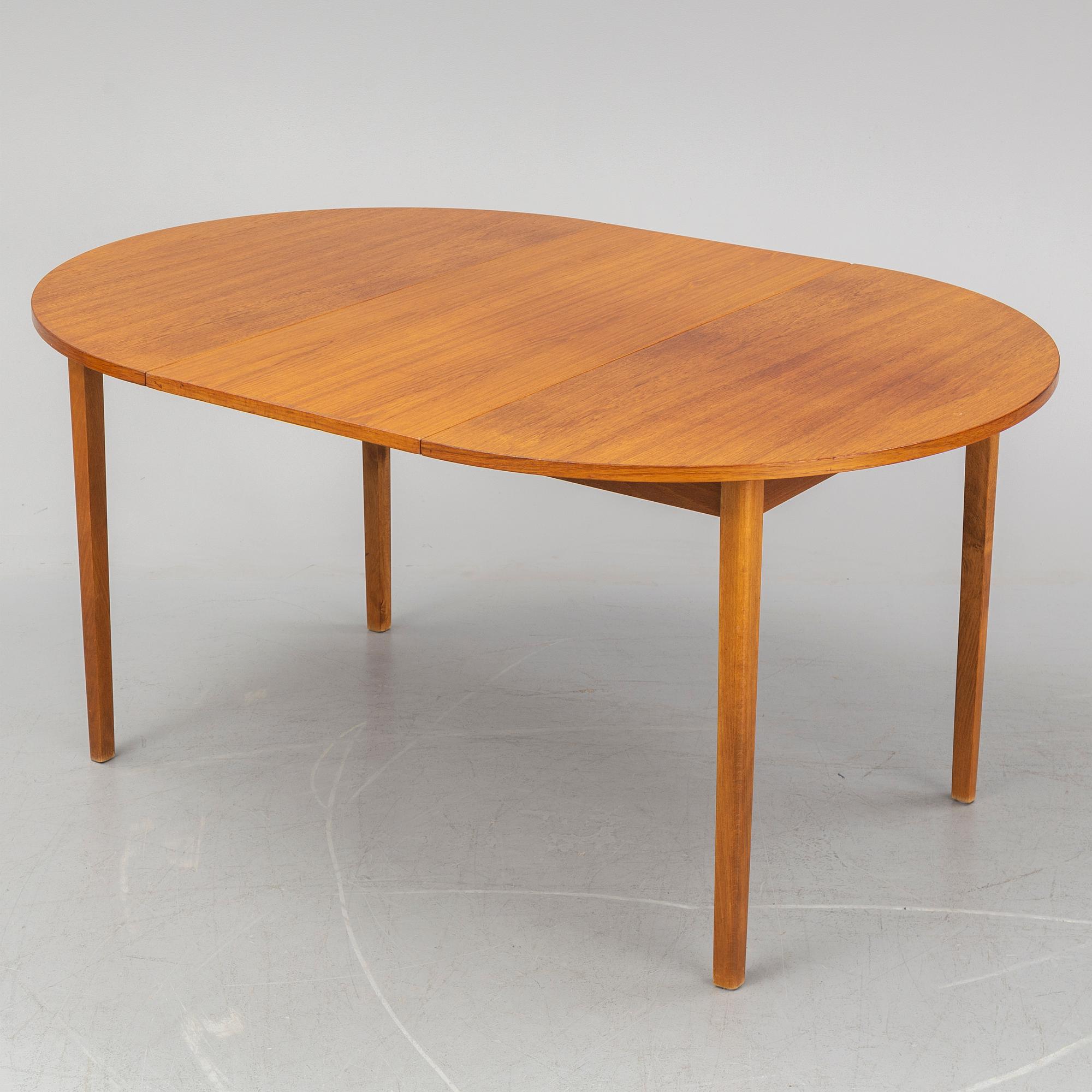 A teak veneered table, second half of the 20th century.