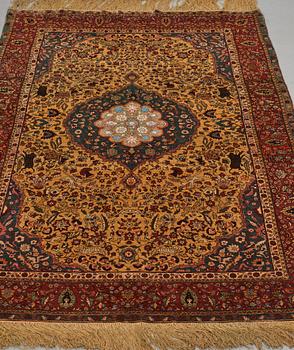 A rug, a semi-antique silk Turkish with metal brocade, ca 194-195 x 127,5-132,5 cm.