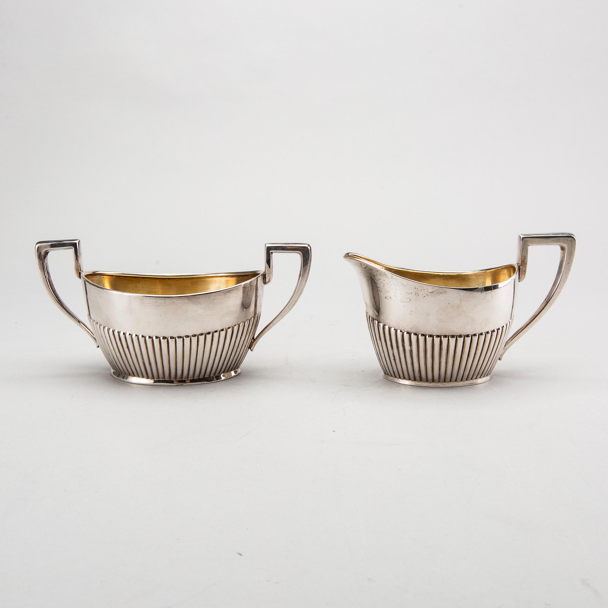 A three piece silver coffee service mark of CG Hallberg Stockholm 1916, weight 896 gram.