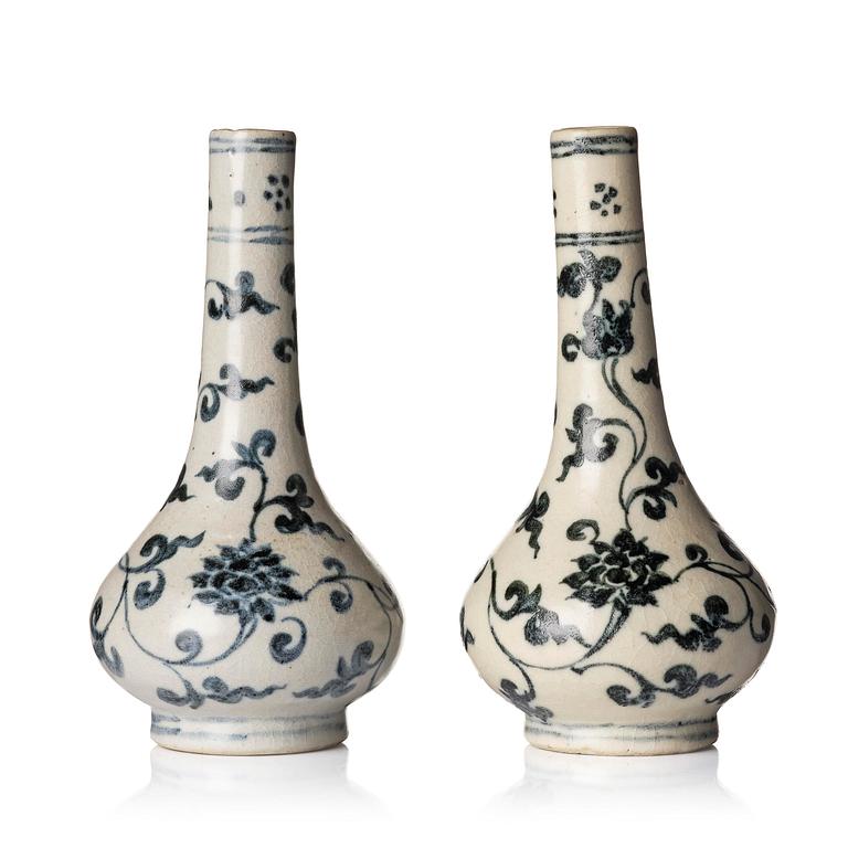 A pair of blue and white lotus vases/water sprinklers, Ming dynasty (1368-1644).