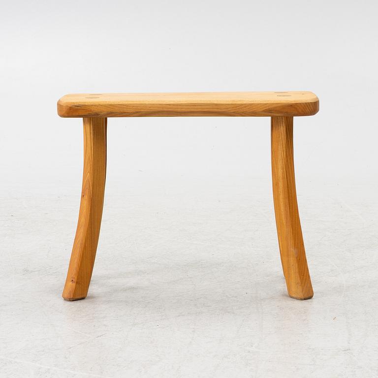 A solid pine stool, signed RO -99, Sweden.