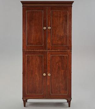 A late Gustavian mahogny cupboard.