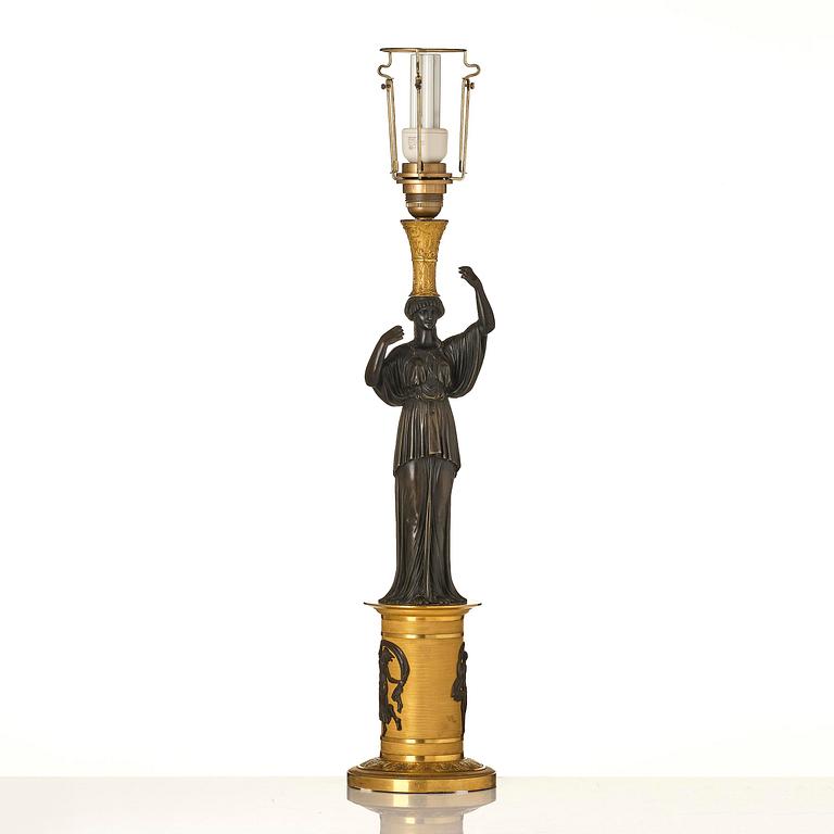 A French Empire ormolu and patinated lamp, early 19th century.