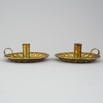 A pair of brass baroque style candlesticks.
