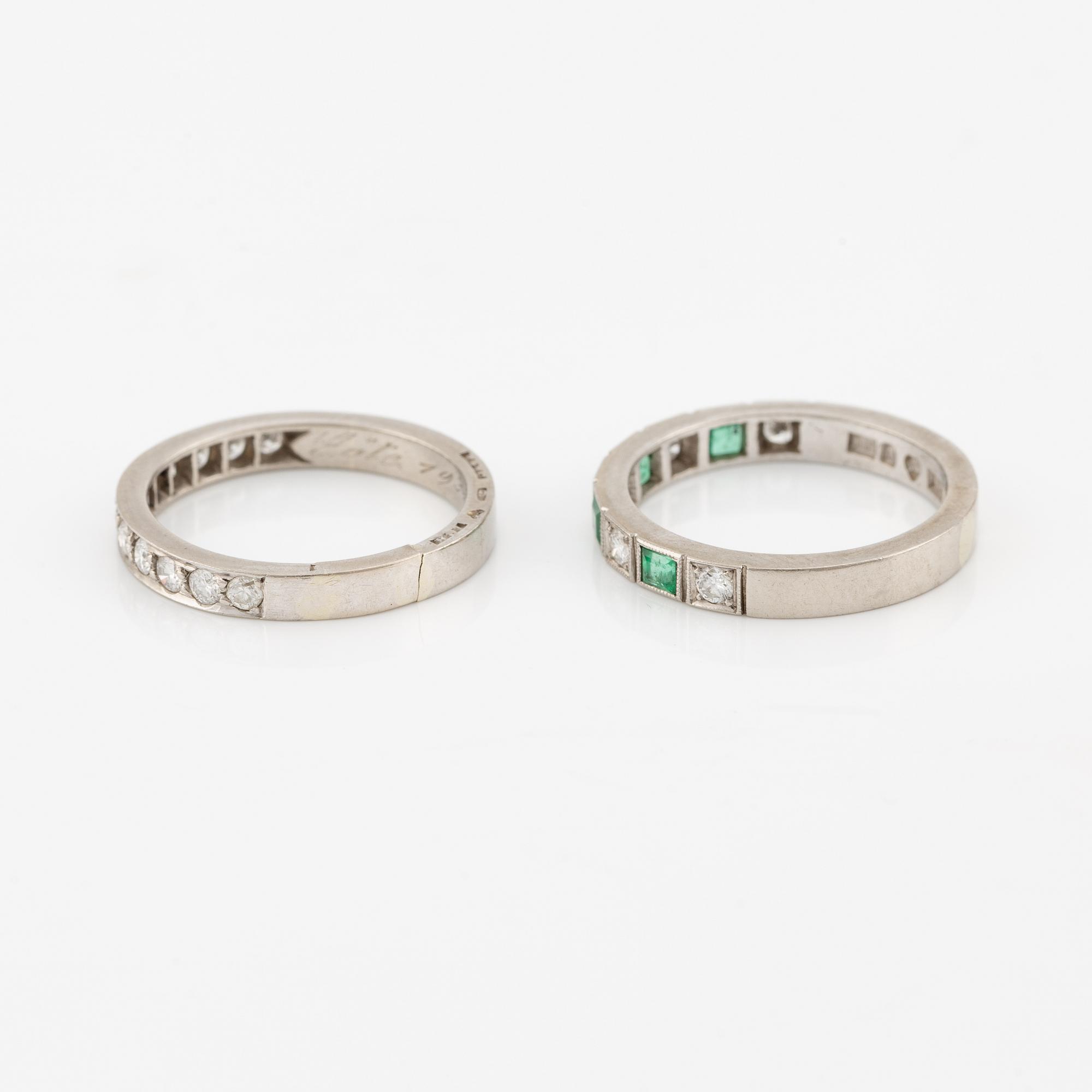 Rings, 2 pcs, alliance rings, 18K white gold with diamonds, one of them with diamonds and emeralds.