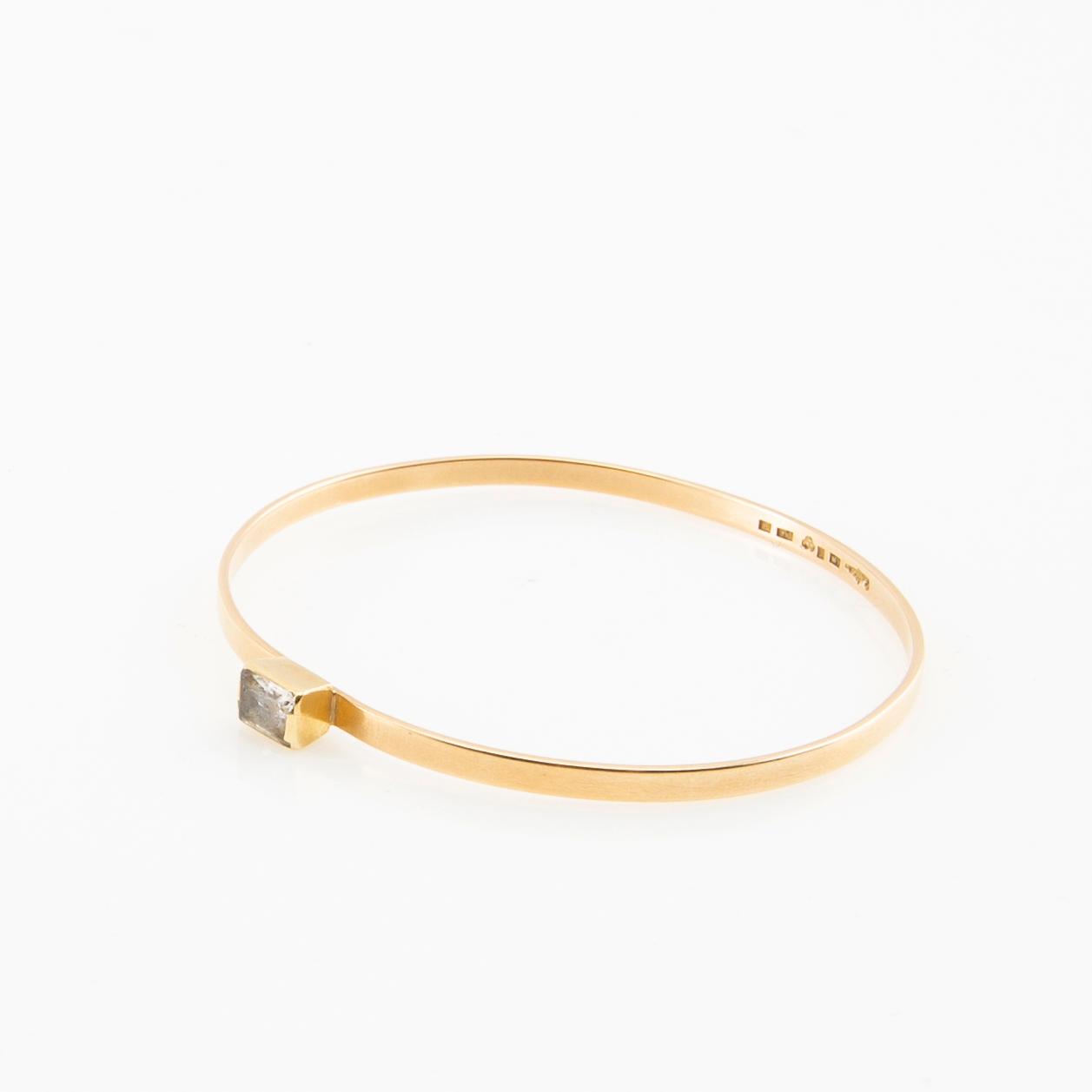 Wiwen Nilsson, Armring 18K gold with a synthetic white spinel, Lund 1967.