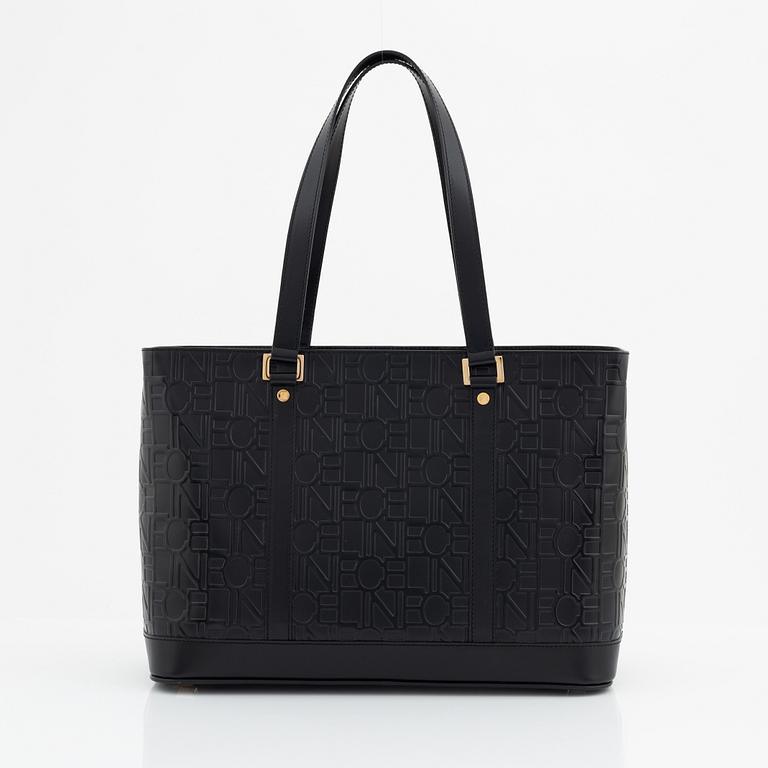 Céline, a black leather bag.