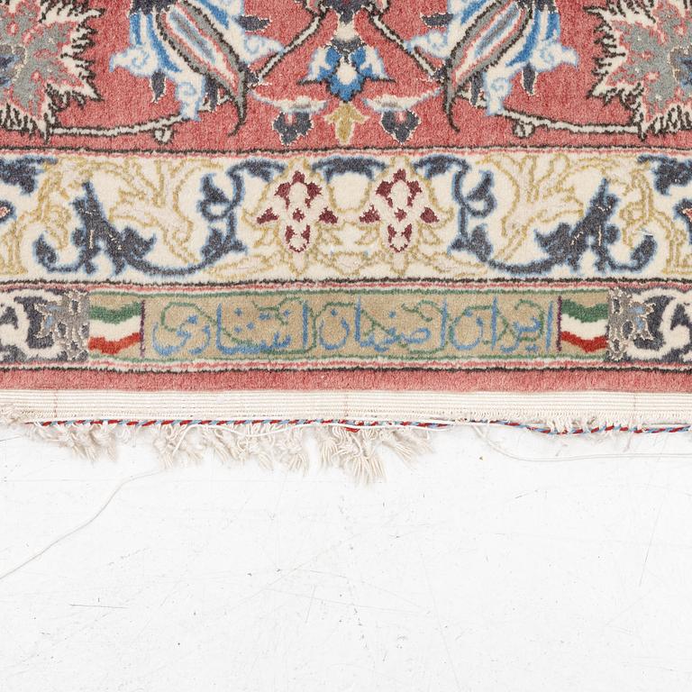 An Isfahan carpet, signed, approx. 372 x 255 cm.