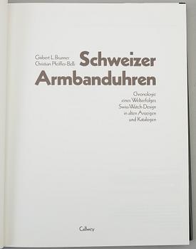 A set of 5 watch books.