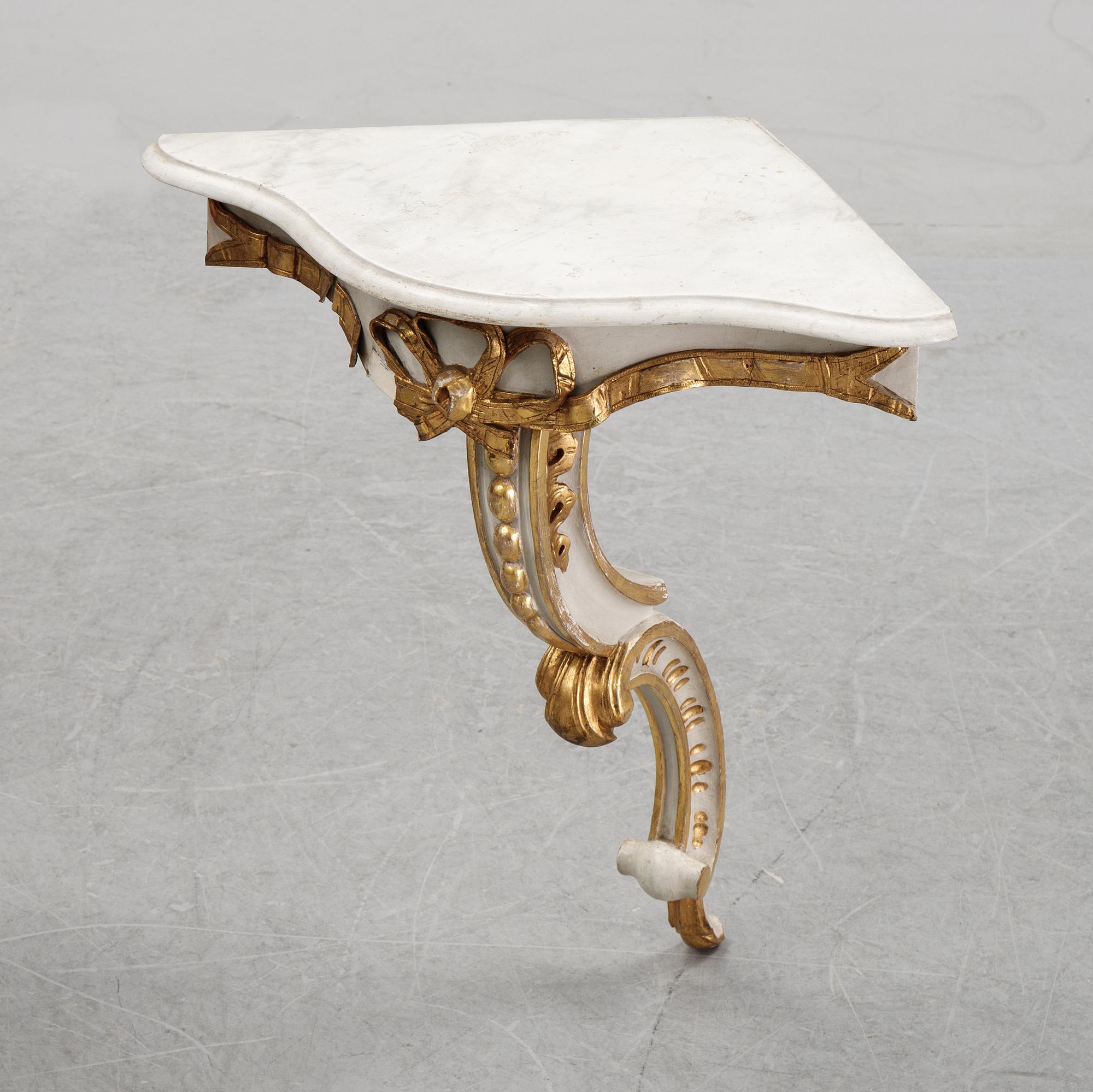A samll console table for a corner with a wooden top.