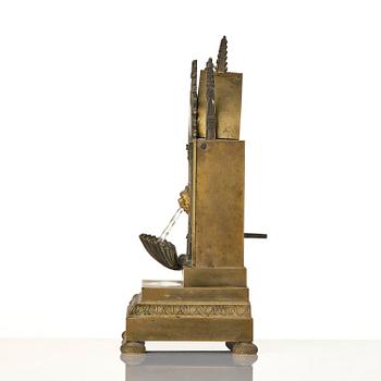 An English neo-Gothic patinated and ormolu mechanical mantel clock, ca 1820.