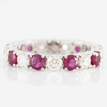Ring, full eternity band, 18K white gold set with rubies and brilliant-cut diamonds.