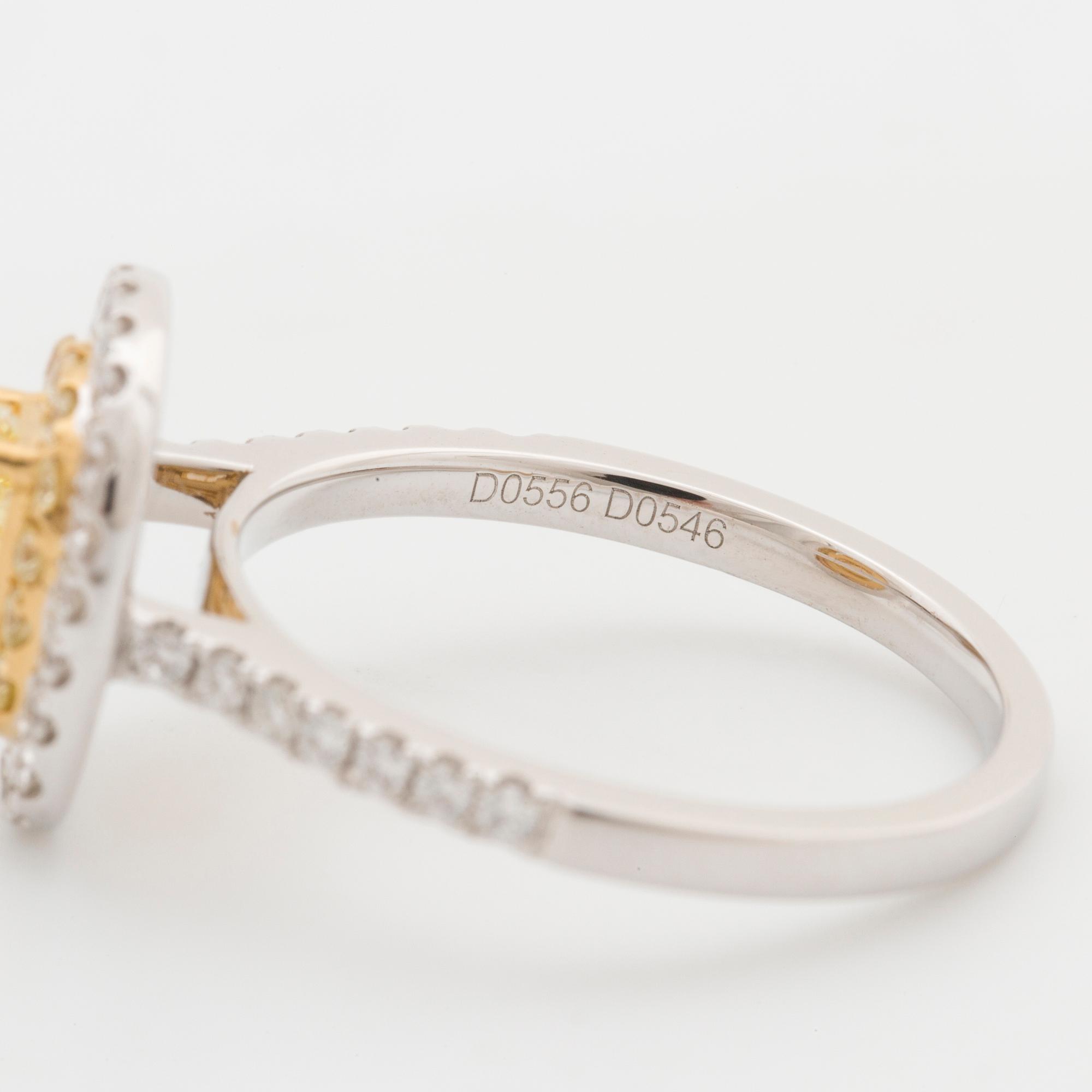 RING, med fancy yellow diamant 0.55 ct samt 50 briljantslipade diamanter 1.10 ct.