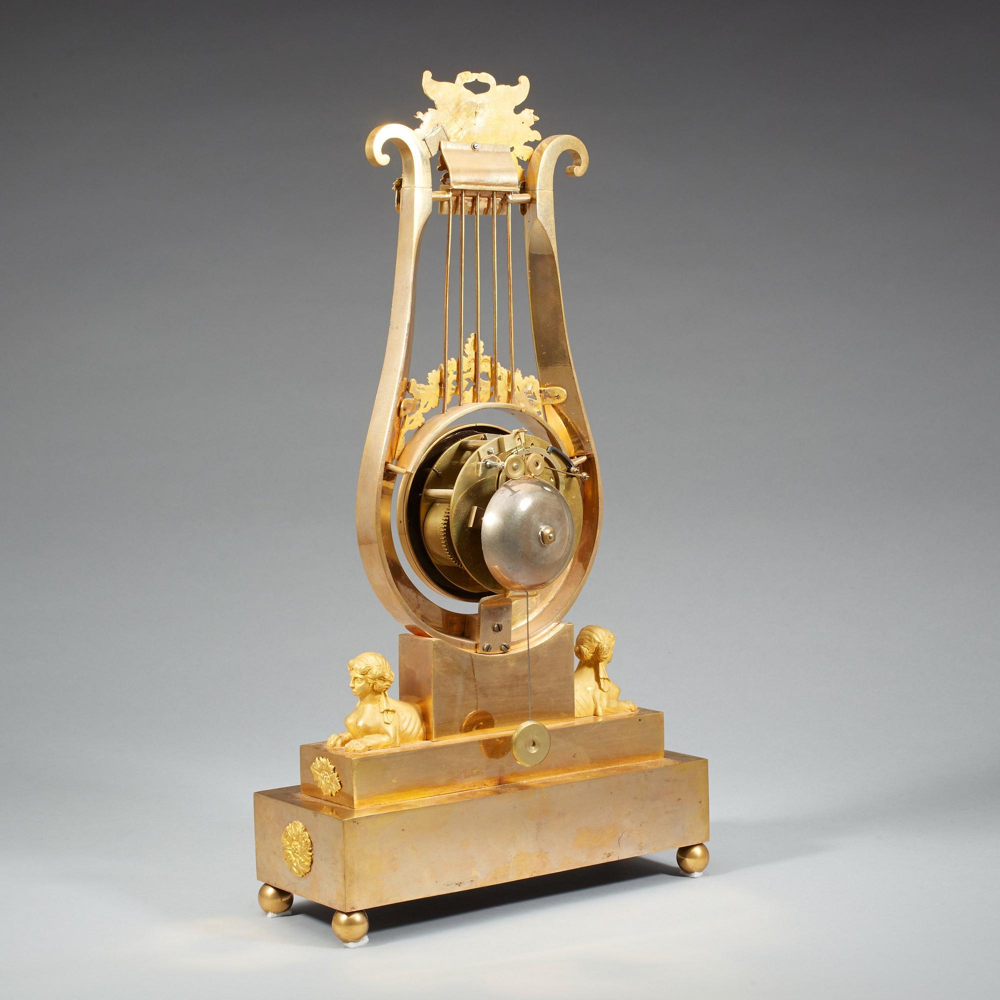 A late Gustavian early 19th century gilt bronze mantel clock.