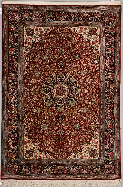 A SILK QUM RUG, around 154 x 101 cm.