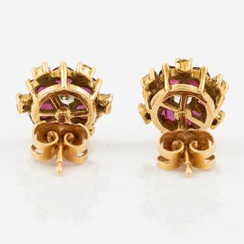 Earrings, a pair, 18K gold with rubies and brilliant-cut diamonds.