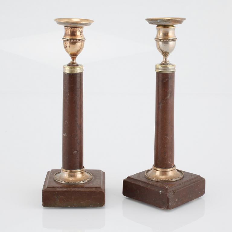 A pair of late gustavian candlesticks, made around year 1800.