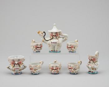 A set of eight doll tea service parts. England 20th Century.