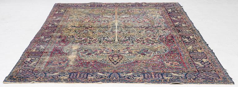 A semi-antique Kerman carpet, c. 325 x 203 cm.