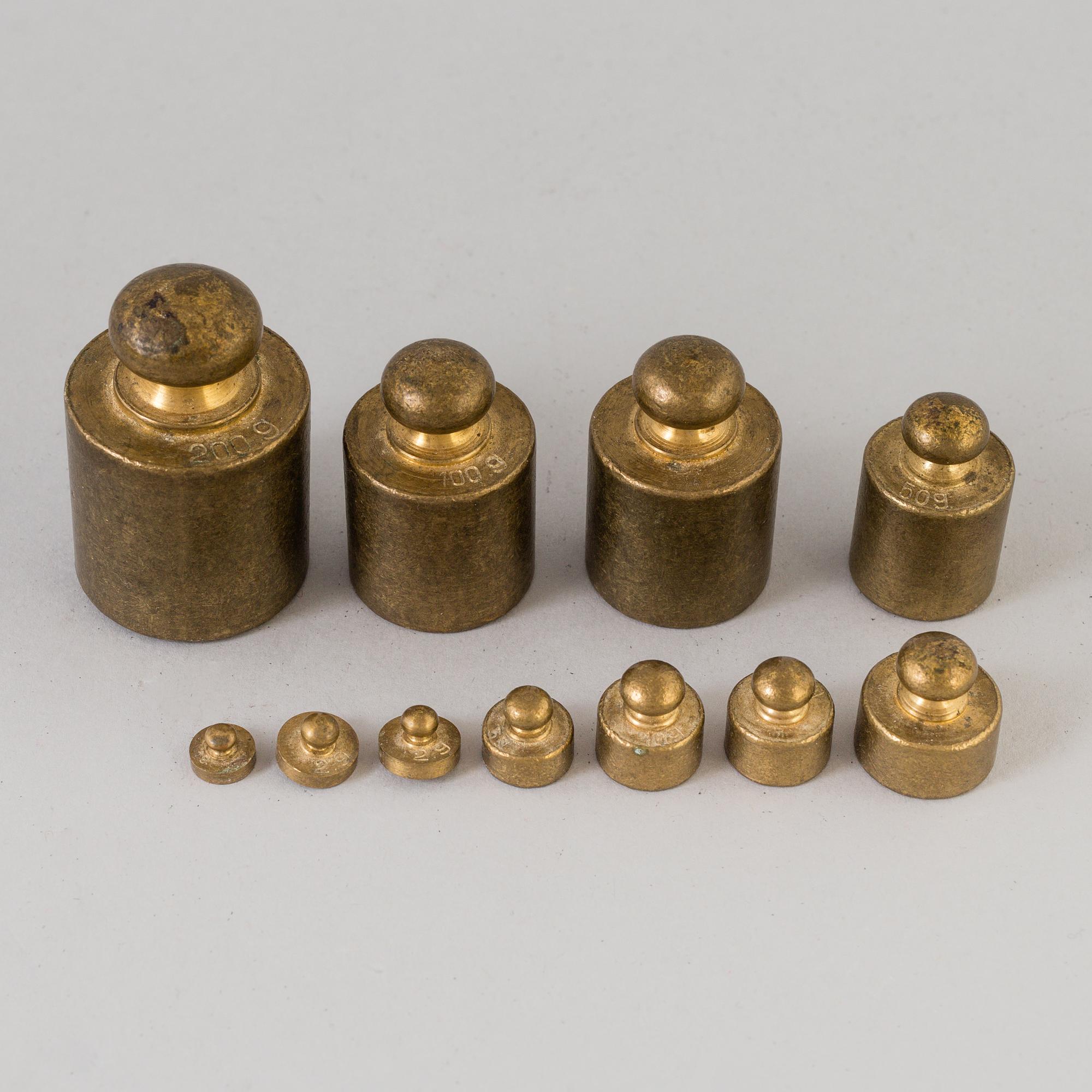 A 20th century cast iron balance with brass and iron weights, partly Skultuna, Sweden.