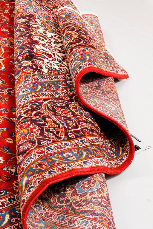 A Keshan rug, signed, 409 x 308 cm.