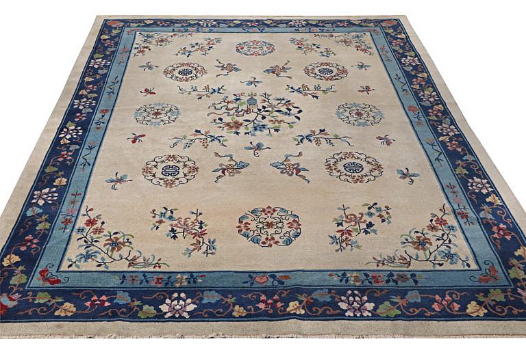 A semi-antique carpet, China, c. 350 x 275 cm.