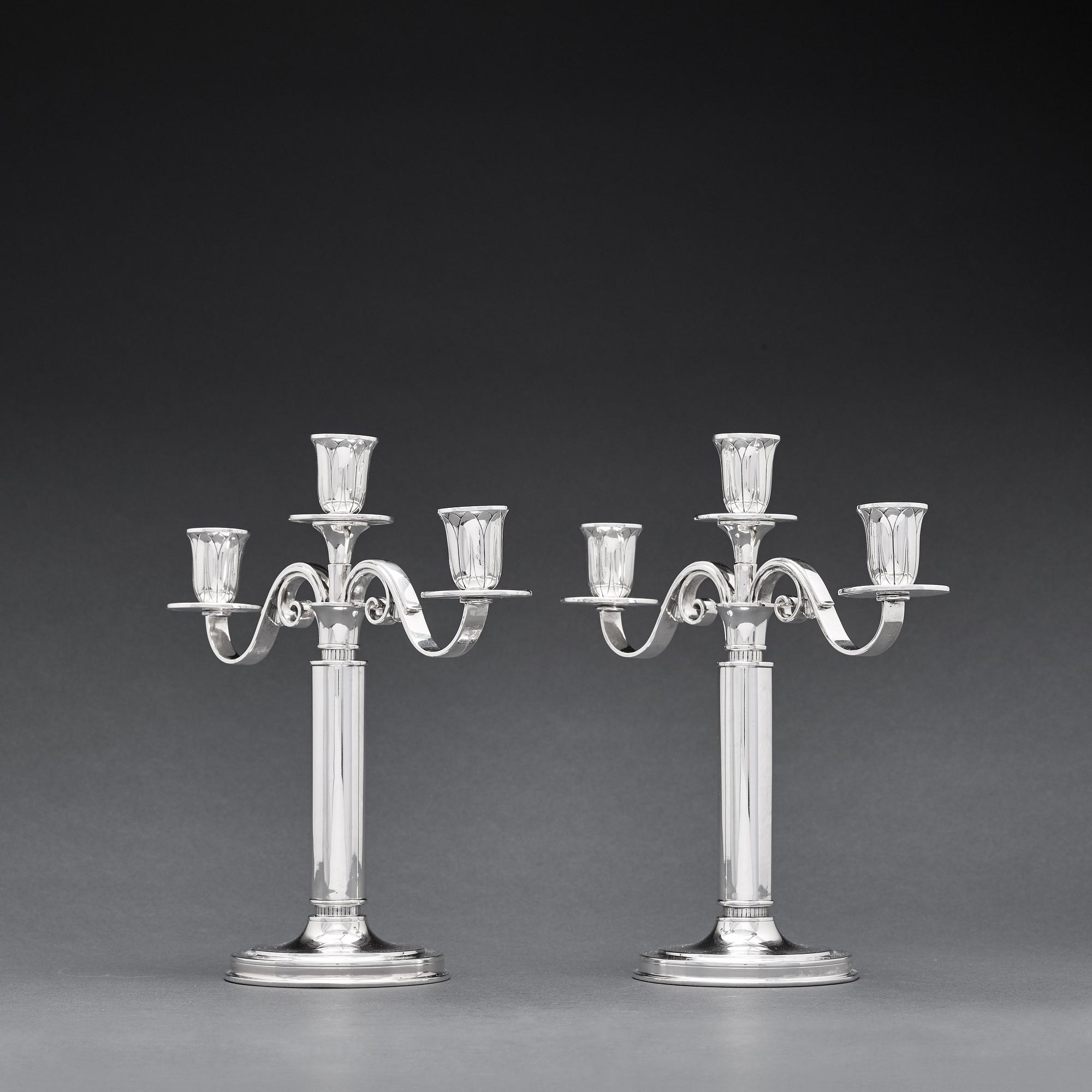 W.A Bolin, a pair of two branched silver candelabra, Stockholm 1935.