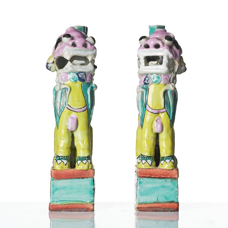 A pair of famille rose 'buddhist lion' joss stick holders, Qing dynasty, circa 1800.
